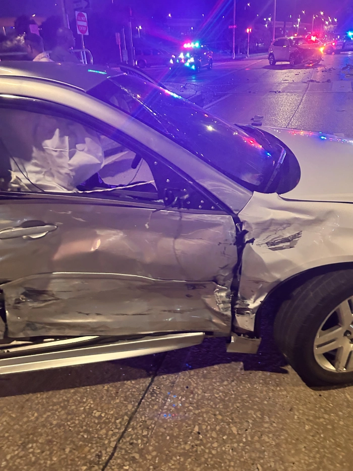 Tampa Red Light Crash Guardrail Impact Tampa Crash Scene Showing Vehicle Pushed Toward Guardrail After Red Light Collision